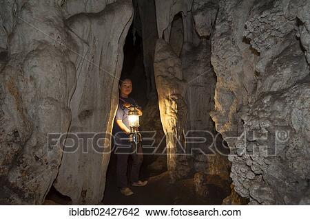 "Thai woman holding a lantern, cave formation, Tham Lot Cave, Soppong or Pang Mapha, Mae Hong Son province, Northern Thailand, Thailand, Asia" View Large Photo Image Stock Image - "Thai woman holding a lantern, cave formation, Tham Lot Cave, Soppong or Pang Mapha, Mae Hong Son province, Northern Thailand, Thailand, Asia". Fotosearch