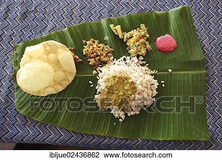 "Thali, a typical Indian dish consisting of rice, fish, dhal, vegetables and pappadom or poppadom, served on a banana leaf, Varkala, Kerala, India, Asia" View Large Photo Image Stock Image - "Thali, a typical Indian dish consisting of rice, fish, dhal, vegetables and pappadom or poppadom, served on a banana leaf, Varkala, Kerala, India, Asia". Fotosearch