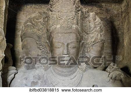 Stock Photography - "The 3 faces of Shiva, carved out of solid rock, inside the main cave on Elephanta Island, Mumbai, Maharashtra, India, Asia". Fotosearch