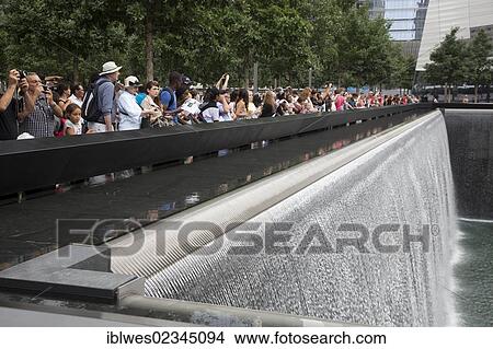 "The 9-11 Memorial, commemorating the September 11, 2001 attacks on the World Trade Center and the Pentagon; the focus of the memorial is two pools constructed on the locations where the twin World Trade Center towers stood, New York, NY, USA" View Large Photo Image Picture - "The 9-11 Memorial, commemorating the September 11, 2001 attacks on the World Trade Center and the Pentagon; the focus of the memorial is two pools constructed on the locations where the twin World Trade Center towers stood, New York, NY, USA". Fotosearch
