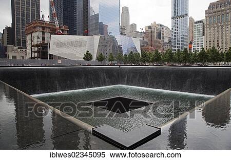Stock Photography - "The 9-11 Memorial, commemorating the September 11, 2001 attacks on the World Trade Center and the Pentagon; the focus of the memorial is two pools constructed on the locations where the twin World Trade Center towers stood, New York, NY, USA". Fotosearch