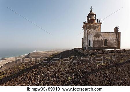 "The abandoned lighthouse Farol de Morro on the black mountain """"Morro """" on the east coast of the island of Boa Vista, Cape Verde, Republic of Cabo Verde, Africa" View Large Photo Image Stock Image - "The abandoned lighthouse Farol de Morro on the black mountain """"Morro """" on the east coast of the island of Boa Vista, Cape Verde, Republic of Cabo Verde, Africa". Fotosearch