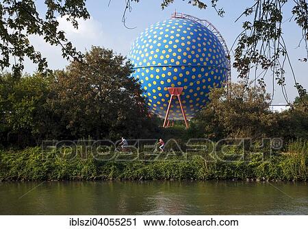 "The artistically designed spherical gas tank called """"Der Ball"""", with the Rhine-Herne Canal in front, Gelsenkirchen, Ruhr district, North Rhine-Westphalia, Germany, Europe" View Large Photo Image Stock Image - "The artistically designed spherical gas tank called """"Der Ball"""", with the Rhine-Herne Canal in front, Gelsenkirchen, Ruhr district, North Rhine-Westphalia, Germany, Europe". Fotosearch