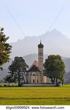 "The baroque Coloman Church against the Schwangau Mountains, Schwangau, Bavaria, Germany, Europe" View Large Photo Image Picture - "The baroque Coloman Church against the Schwangau Mountains, Schwangau, Bavaria, Germany, Europe". Fotosearch