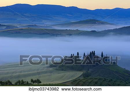 "The Belvedere, morning fog, at dawn, Val d'Orcia, or Orcia Valley, UNESCO World Heritage Site, San Quirico d'Orcia, Val d'Orcia, Province of Siena, Tuscany, Italy, Europe" View Large Photo Image Stock Image - "The Belvedere, morning fog, at dawn, Val d'Orcia, or Orcia Valley, UNESCO World Heritage Site, San Quirico d'Orcia, Val d'Orcia, Province of Siena, Tuscany, Italy, Europe". Fotosearch