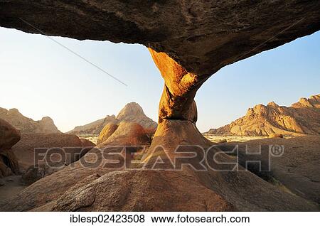 The Bridge rock formation in the evening sun, natural stone arch, Pontok Mountains, Great Spitzkoppe Mountain, Spitzkoppe, Grosse Spitzkuppe Nature Reserve, Namibia, Africa View Large Photo Image Stock Photo - The Bridge rock formation in the evening sun, natural stone arch, Pontok Mountains, Great Spitzkoppe Mountain, Spitzkoppe, Grosse Spitzkuppe Nature Reserve, Namibia, Africa. Fotosearch