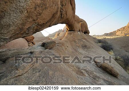 The Bridge rock formation, natural stone arch, Pontok Mountains, Great Spitzkoppe Mountain, Spitzkoppe, Grosse Spitzkuppe Nature Reserve, Namibia, Africa View Large Photo Image Stock Photo - The Bridge rock formation, natural stone arch, Pontok Mountains, Great Spitzkoppe Mountain, Spitzkoppe, Grosse Spitzkuppe Nature Reserve, Namibia, Africa. Fotosearch