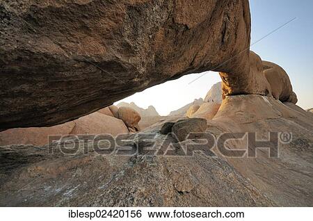 The Bridge rock formation, natural stone arch, Pontok Mountains, Great Spitzkoppe Mountain, Spitzkoppe, Grosse Spitzkuppe Nature Reserve, Namibia, Africa View Large Photo Image Stock Photograph - The Bridge rock formation, natural stone arch, Pontok Mountains, Great Spitzkoppe Mountain, Spitzkoppe, Grosse Spitzkuppe Nature Reserve, Namibia, Africa. Fotosearch