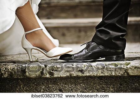 The bridge's foot stepping on the groom's foot View Large Photo Image Stock Image - The bridge's foot stepping on the groom's foot. Fotosearch
