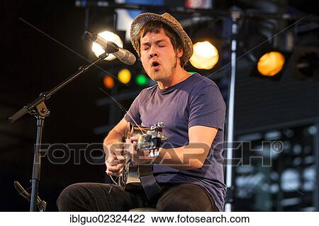 "The British singer songwriter Jon Kenzie playing live outside KKL Plaza at the Blue Balls Festival, Lucerne, Switzerland, Europe" View Large Photo Image Stock Image - "The British singer songwriter Jon Kenzie playing live outside KKL Plaza at the Blue Balls Festival, Lucerne, Switzerland, Europe". Fotosearch