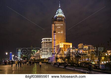 Stock Image - "The Bund, promenade at the Huangpu River at night, Shanghai, China, Asia". Fotosearch