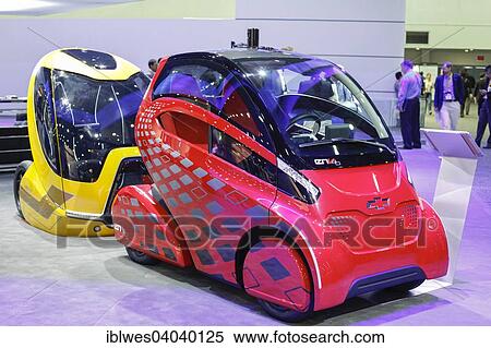 Stock Photography - "The Chevrolet EN-V 2. 0 Concept Vehicle, front, an electric car that can drive itself at low speeds, on display at the Intelligent Transport Systems World Congress, Detroit, Michigan, United States, North America". Fotosearch