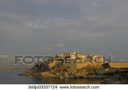 "The citadel (castle) of Calvi surrounded by the mediterranean sea in front of the steep mountains of Corsica. Calvi is in the department Haute-Corse, France on the mediterranean island of Corsica, Calvi, Corsica, France, Europe" View Large Photo Image Picture - "The citadel (castle) of Calvi surrounded by the mediterranean sea in front of the steep mountains of Corsica. Calvi is in the department Haute-Corse, France on the mediterranean island of Corsica, Calvi, Corsica, France, Europe". Fotosearch