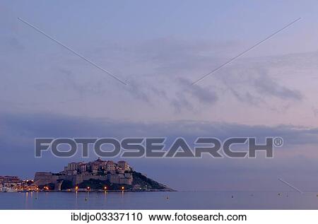 "The citadel (castle) of Calvi surrounded by the mediterranean sea at the blue hour before sunrise. Calvi is in the department Haute-Corse, France on the mediterranean island of Corsica, Calvi, Corsica, France, Europe" View Large Photo Image Stock Image - "The citadel (castle) of Calvi surrounded by the mediterranean sea at the blue hour before sunrise. Calvi is in the department Haute-Corse, France on the mediterranean island of Corsica, Calvi, Corsica, France, Europe". Fotosearch