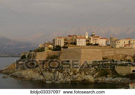 "The citadel (castle) of Calvi surrounded by the mediterranean sea in front of the steep mountains of Corsica. Calvi is in the department Haute-Corse, France on the mediterranean island of Corsica, Calvi, Corsica, France, Europe" View Large Photo Image Stock Photo - "The citadel (castle) of Calvi surrounded by the mediterranean sea in front of the steep mountains of Corsica. Calvi is in the department Haute-Corse, France on the mediterranean island of Corsica, Calvi, Corsica, France, Europe". Fotosearch
