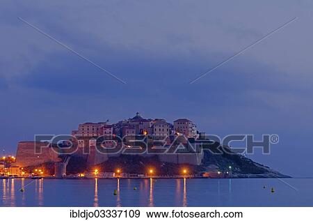 "The citadel (castle) of Calvi surrounded by the mediterranean sea at the blue hour before sunrise. Calvi is in the department Haute-Corse, France on the mediterranean island of Corsica, Calvi, Corsica, France, Europe" View Large Photo Image Stock Photo - "The citadel (castle) of Calvi surrounded by the mediterranean sea at the blue hour before sunrise. Calvi is in the department Haute-Corse, France on the mediterranean island of Corsica, Calvi, Corsica, France, Europe". Fotosearch