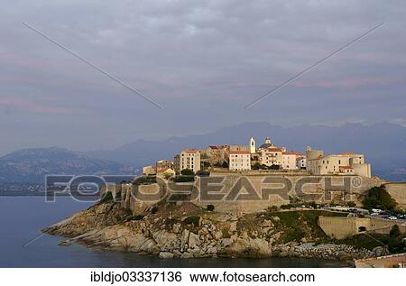 "The citadel (castle) of Calvi surrounded by the mediterranean sea in front of the steep mountains of Corsica. Calvi is in the department Haute-Corse, France on the mediterranean island of Corsica, Calvi, Corsica, France, Europe" View Large Photo Image Stock Photograph - "The citadel (castle) of Calvi surrounded by the mediterranean sea in front of the steep mountains of Corsica. Calvi is in the department Haute-Corse, France on the mediterranean island of Corsica, Calvi, Corsica, France, Europe". Fotosearch