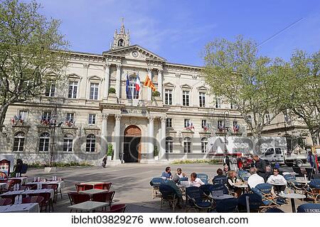 Stock Photograph - "The city hall and a sidewalk cafe, Avignon, Vaucluse, Provence-Alpes-Cote d'Azur, Southern France, France, Europe". Fotosearch