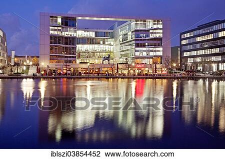 "The colourfully lit """"H2 Office"""" building at dusk, Innenhafen, Inner Harbour, Duisburg, Ruhr Area, North Rhine-Westphalia, Germany, Europe" View Large Photo Image Stock Image - "The colourfully lit """"H2 Office"""" building at dusk, Innenhafen, Inner Harbour, Duisburg, Ruhr Area, North Rhine-Westphalia, Germany, Europe". Fotosearch