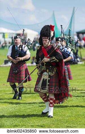 "The Drum Major leading the bagpipe parade, Helmsdale Highland Games, Helmsdale, Sutherland, Scotland, United Kingdom, Europe" View Large Photo Image Stock Image - "The Drum Major leading the bagpipe parade, Helmsdale Highland Games, Helmsdale, Sutherland, Scotland, United Kingdom, Europe". Fotosearch