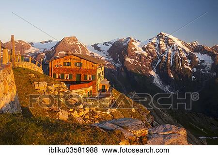 Stock Photo - "The Edelweisshuette refuge on Mt Edelweissspitze, mountains Hohe Dock and Grosses Wiesbachhorn at back, Grossglockner High Alpine Road, High Tauern, Zell am See District, Salzburg State, Austria, Europe". Fotosearch
