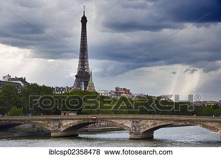 Stock Photo - "The Eiffel Tower during summer storm in Paris, France, Europe". Fotosearch