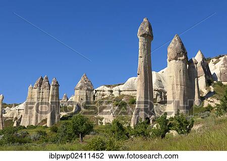 "The Fairy Chimneys of Love Valley, volcanic tuff rock formations of Goreme, Cappadocia, Turkey, Asia" View Large Photo Image Stock Image - "The Fairy Chimneys of Love Valley, volcanic tuff rock formations of Goreme, Cappadocia, Turkey, Asia". Fotosearch