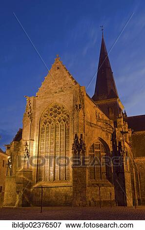Stock Photo - "The flood-lit Collegiate Church Saint-Aubin in Guerande at the blue hour, dusk, Loire-Atlantique department, France, Europe". Fotosearch