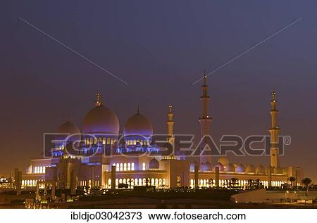 Stock Image - "The floodlit Sheikh Zayed Grand Mosque, at dawn, Abu Dhabi, Emirate of Abu Dhabi, United Arab Emirates, Asia". Fotosearch