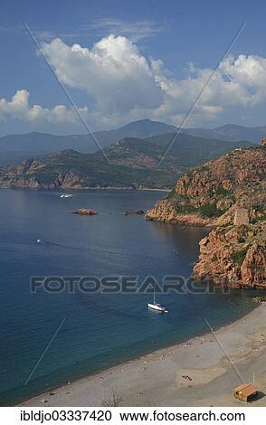 Stock Image - "The Genoese Tower of Porto on top of a rocky hill and the Gulf of Porto, Guaita, Porto, Corsica, France, Europe". Fotosearch