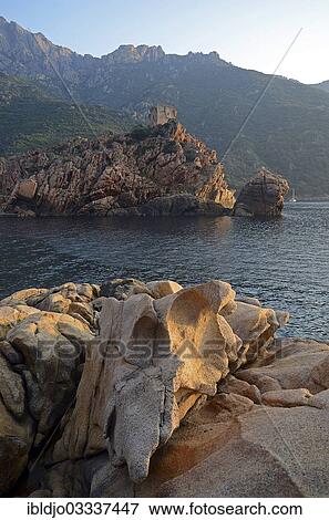 Stock Photo - "The Genoese Tower of Porto on top of a rocky hill and the Gulf of Porto, Guaita, Porto, Corsica, France, Europe". Fotosearch