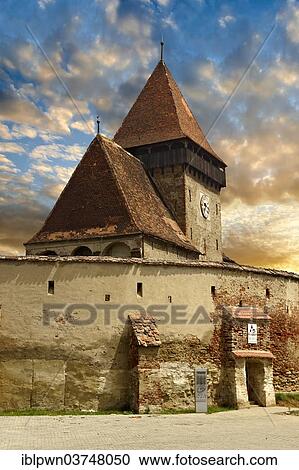 Stock Image - "The Gothic 14th century fortified church of Axente Sever, Sibiu County, Transylvania, Romania, Europe". Fotosearch