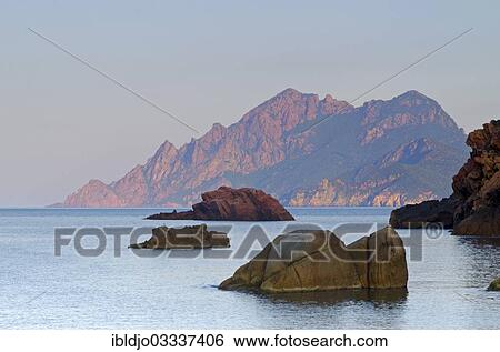 Stock Photograph - "The Gulf of Porto with the surrounding mountains in the morning light, Guaita, Porto, Corsica, France, Europe". Fotosearch