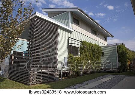 "The Holy Cross Project, a green housing village developed by Global Green, the homes have solar panels, waste cisterns, raingardens, planted roofs, and other environmentally-sustainable features, in the lower ninth ward, New Orleans, Louisiana, USA" View Large Photo Image Stock Photo - "The Holy Cross Project, a green housing village developed by Global Green, the homes have solar panels, waste cisterns, raingardens, planted roofs, and other environmentally-sustainable features, in the lower ninth ward, New Orleans, Louisiana, USA". Fotosearch