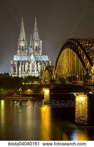 "The illuminated Cologne Cathedral and Hohenzollern Bridge at night with Rhine, Deutz, Cologne, North Rhine-Westphalia, Germany, Europe" View Large Photo Image Stock Image - "The illuminated Cologne Cathedral and Hohenzollern Bridge at night with Rhine, Deutz, Cologne, North Rhine-Westphalia, Germany, Europe". Fotosearch