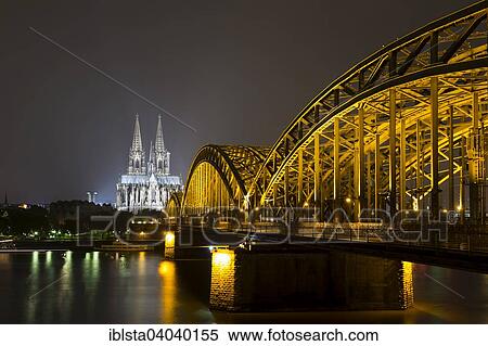"The illuminated Cologne Cathedral and Hohenzollern Bridge at night with Rhine, Deutz, Cologne, North Rhine-Westphalia, Germany, Europe" View Large Photo Image Stock Photography - "The illuminated Cologne Cathedral and Hohenzollern Bridge at night with Rhine, Deutz, Cologne, North Rhine-Westphalia, Germany, Europe". Fotosearch