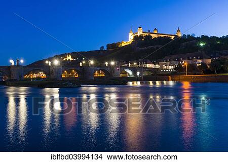 Picture - "The illuminated Festung Marienberg castle located on a hill above the town, the Alte Mainbrucke bridge crossing the river Main, at night, Wurzburg, Bavaria, Germany, Europe". Fotosearch