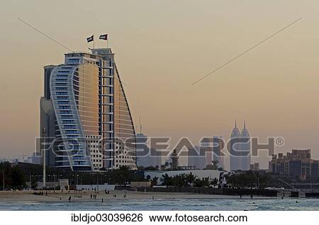 "The illuminated Jumeirah Beach Hotel on Jumeirah beach at dusk, Emirate of Dubai, United Arab Emirates, Asia" View Large Photo Image Stock Photograph - "The illuminated Jumeirah Beach Hotel on Jumeirah beach at dusk, Emirate of Dubai, United Arab Emirates, Asia". Fotosearch
