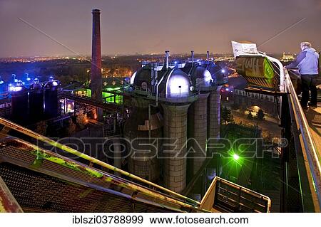 "The illuminated Landschaftspark Duisburg-Nord, public park on a former industrial site, from blast furnace No 5, Duisburg, Ruhr Area, North Rhine-Westphalia, Germany, Europe" View Large Photo Image Stock Photo - "The illuminated Landschaftspark Duisburg-Nord, public park on a former industrial site, from blast furnace No 5, Duisburg, Ruhr Area, North Rhine-Westphalia, Germany, Europe". Fotosearch