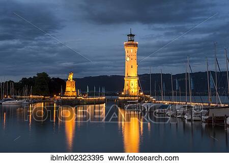 "The illuminated lighthouse and the Bavarian lion in the port of Lindau, Lake Constance, Bavaria, Germany, Europe" View Large Photo Image Stock Photography - "The illuminated lighthouse and the Bavarian lion in the port of Lindau, Lake Constance, Bavaria, Germany, Europe". Fotosearch