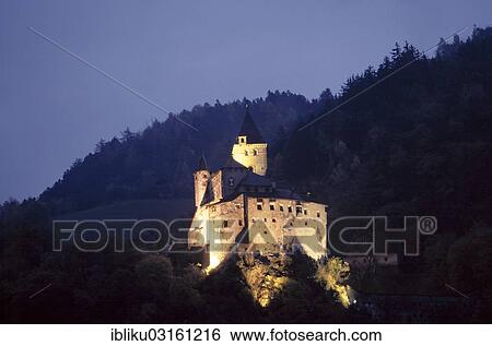 Stock Photograph - "The illuminated Trostburg Castle at dusk, Eisacktal, South Tyrol province, Trentino-Alto Adige, Italy, Europe". Fotosearch