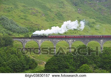 "The Jacobite, steam train, travelling over Glenfinnan Viaduct, made famous in the Harry Potter films, Ross, Skye and Lochaber, Scottish Highlands, Scotland, United Kingdom, Europe" View Large Photo Image Stock Photo - "The Jacobite, steam train, travelling over Glenfinnan Viaduct, made famous in the Harry Potter films, Ross, Skye and Lochaber, Scottish Highlands, Scotland, United Kingdom, Europe". Fotosearch