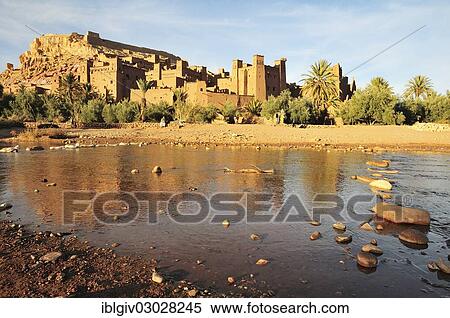 Stock Photography - "The Kasbah and the fortified city or ksar Ait Ben Haddou reflected in the Asif Mellah river, High Atlas, Ait Ben Haddou, Souss-Massa-Draa region, Morocco, Africa". Fotosearch
