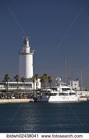 "The lighthouse and a yacht in the port, Malaga, Costa del Sol, Andalusia, Spain, Europe, PublicGround, Europe" View Large Photo Image Stock Image - "The lighthouse and a yacht in the port, Malaga, Costa del Sol, Andalusia, Spain, Europe, PublicGround, Europe". Fotosearch