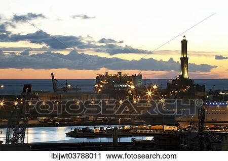 Stock Image - "The Lighthouse of Genoa with cruise ship in the Porto Antico harbour, Genoa, Liguria, Italy, Europe". Fotosearch