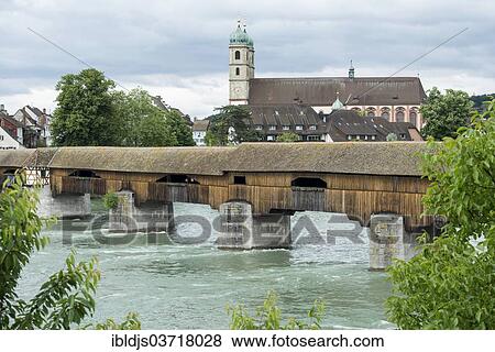 Stock Photo - "The longest covered wooden bridge in Europe, Rhine River and St. Fridolin's Minster, Bad Sackingen, Baden-Wurttemberg, Germany, Europe". Fotosearch