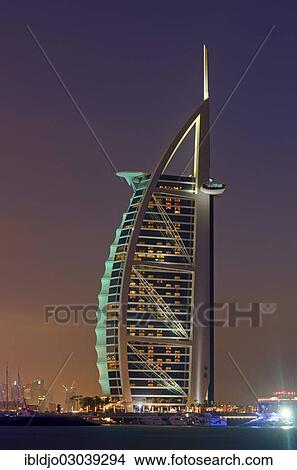 Picture - "The luxury hotel Burj Al Arab off Jumeirah beach at dusk, Emirate of Dubai, United Arab Emirates, Asia". Fotosearch