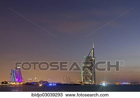 "The luxury hotel Burj Al Arab off Jumeirah beach at dusk, the Jumeirah Beach Hotel on the left, Emirate of Dubai, United Arab Emirates, Asia" View Large Photo Image Stock Image - "The luxury hotel Burj Al Arab off Jumeirah beach at dusk, the Jumeirah Beach Hotel on the left, Emirate of Dubai, United Arab Emirates, Asia". Fotosearch
