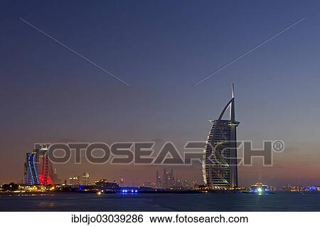 "The luxury hotel Burj Al Arab off Jumeirah beach at dusk, the Jumeirah Beach Hotel on the left, Emirate of Dubai, United Arab Emirates, Asia" View Large Photo Image Stock Photograph - "The luxury hotel Burj Al Arab off Jumeirah beach at dusk, the Jumeirah Beach Hotel on the left, Emirate of Dubai, United Arab Emirates, Asia". Fotosearch