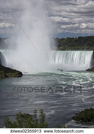Stock Image - "The Maid of the Mist carries tourists to the edge of the falls, Niagara Falls, Ontario, Canada, North America". Fotosearch